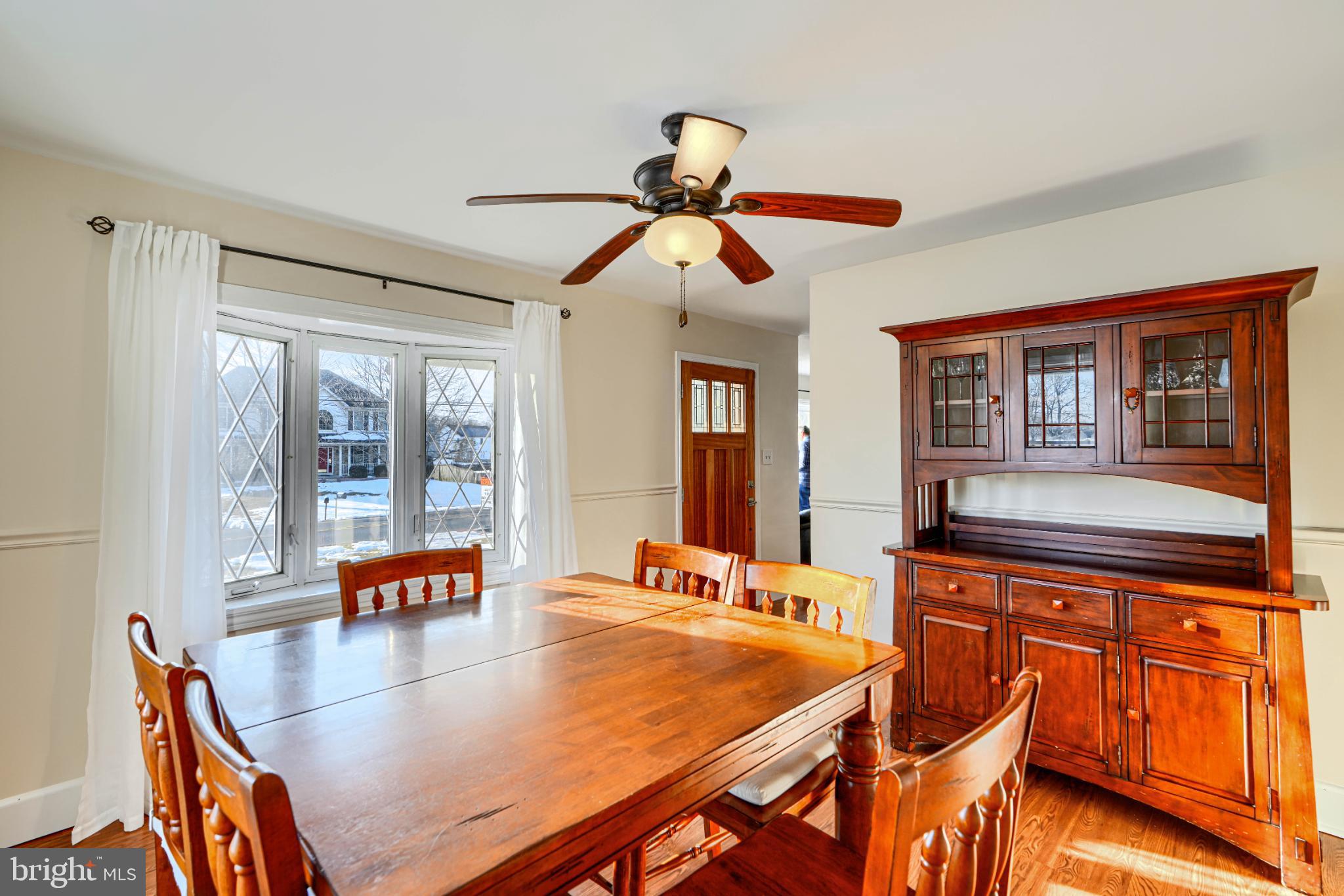 5706 Allender Road White Marsh, MD 21162 - Photo 11 of 61 a dining room with stainless steel appliances granite countertop a dining table chairs with a chandelier