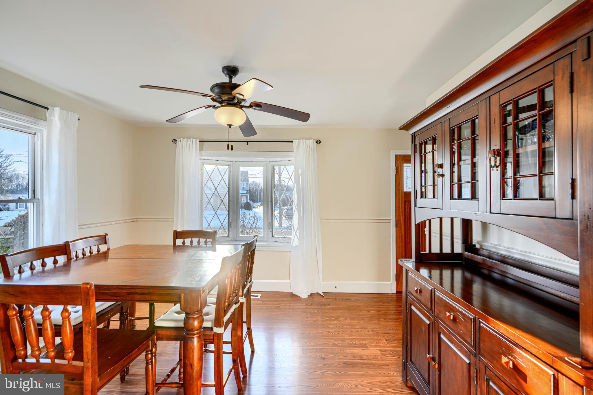 5706 Allender Road White Marsh, MD 21162 - Photo 12 of 61 a view of a dining room with furniture window and wooden floor