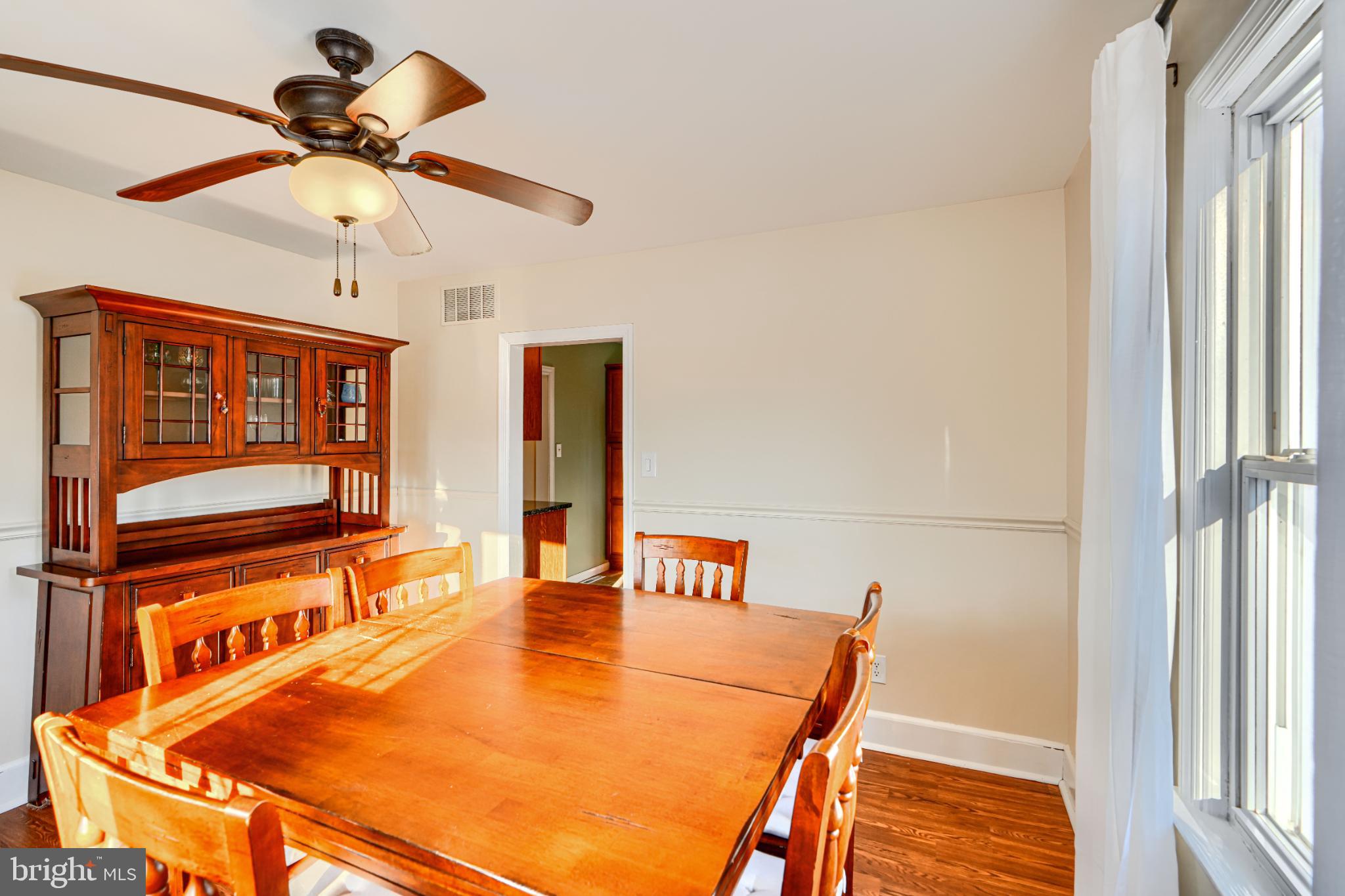 5706 Allender Road White Marsh, MD 21162 - Photo 13 of 61 a view of a dining room with a table and chairs