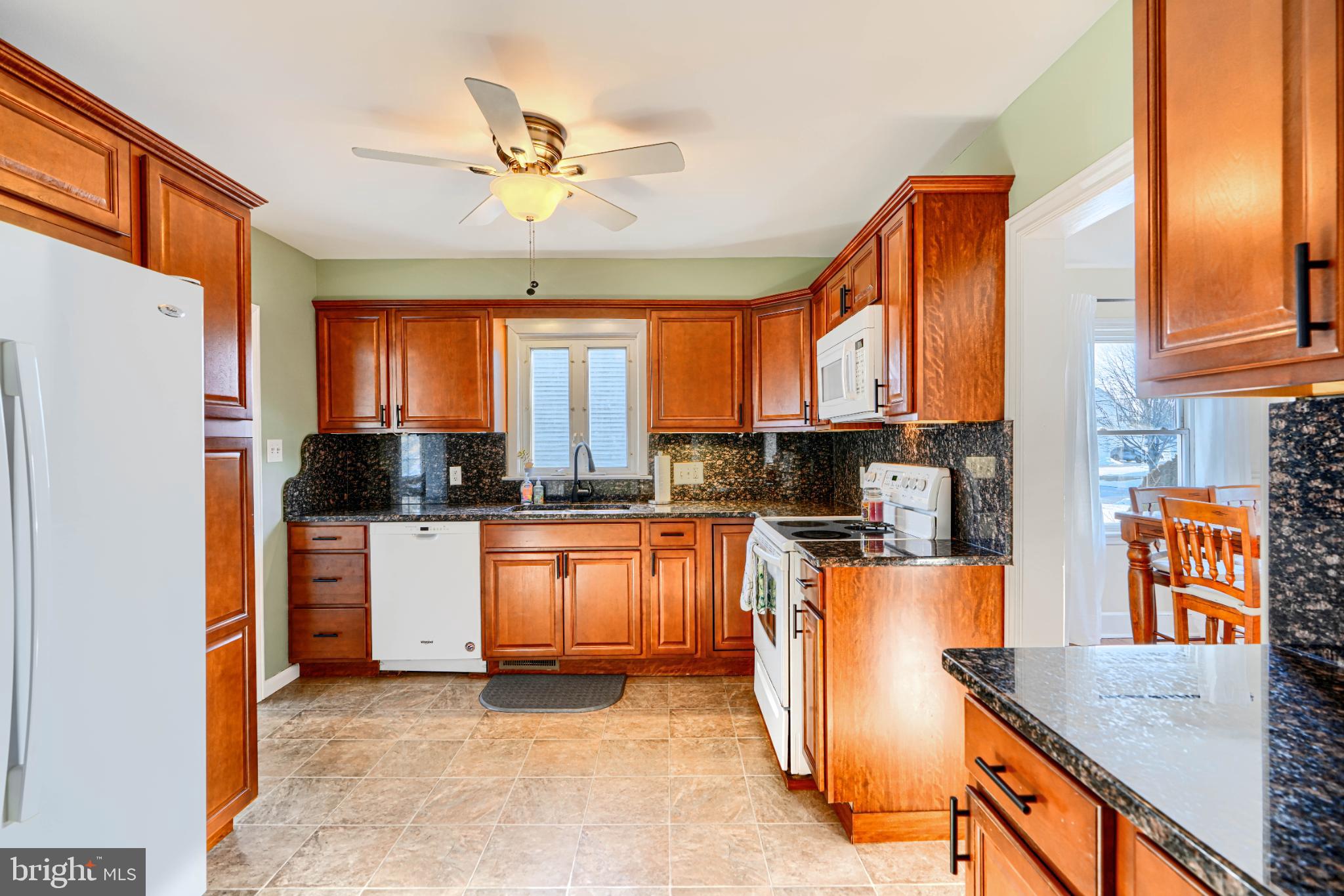 5706 Allender Road White Marsh, MD 21162 - Photo 14 of 61 a kitchen with stainless steel appliances granite countertop a refrigerator a stove top oven a sink and dishwasher