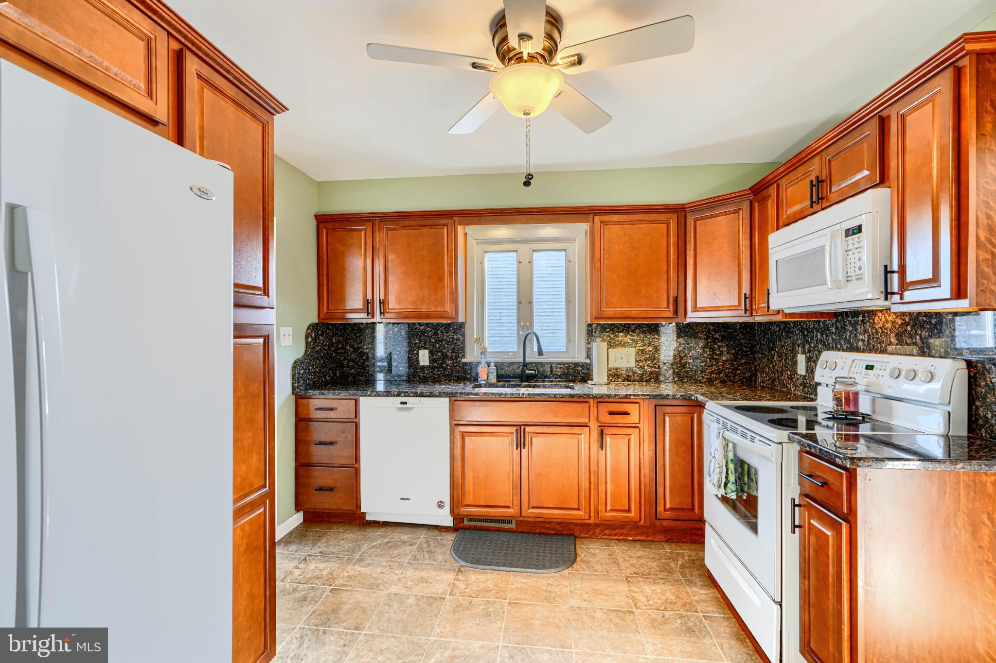 5706 Allender Road White Marsh, MD 21162 - Photo 17 of 61 a kitchen with stainless steel appliances granite countertop a stove a sink and a refrigerator