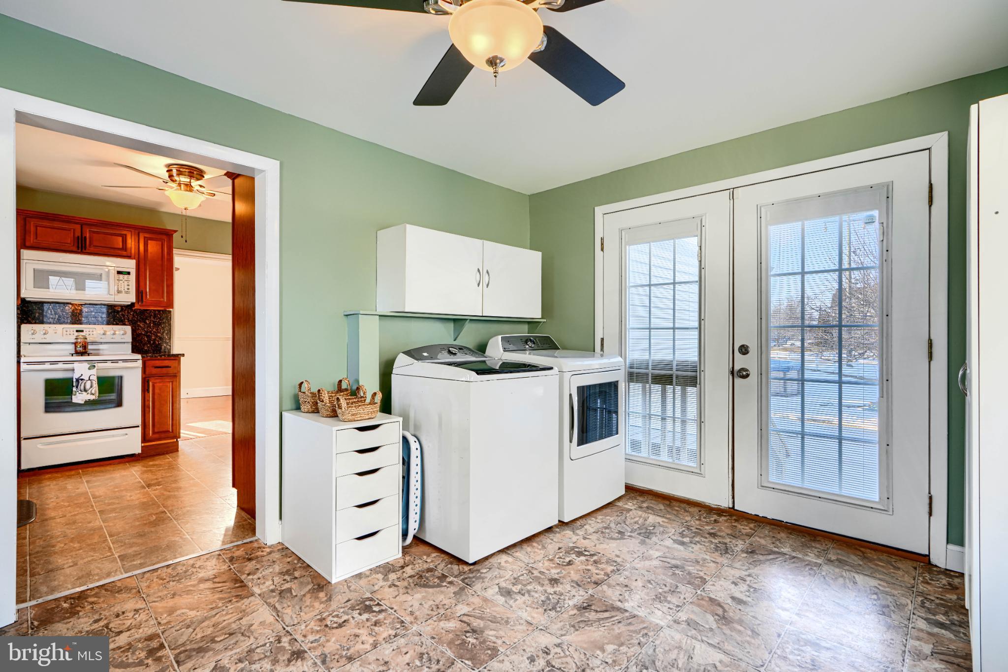 5706 Allender Road White Marsh, MD 21162 - Photo 19 of 61 a view of a kitchen with furniture wooden floor and window