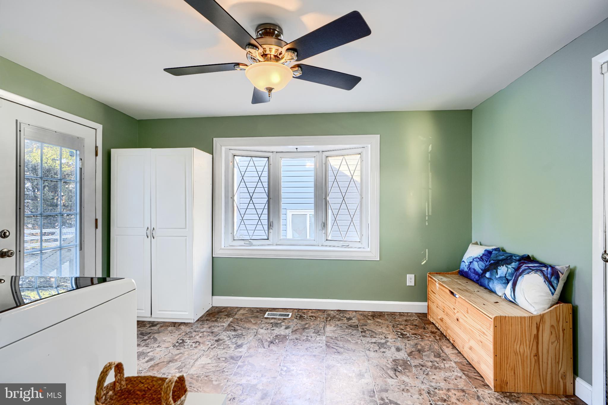 5706 Allender Road White Marsh, MD 21162 - Photo 21 of 61 a view of an empty room with a window and a kitchen