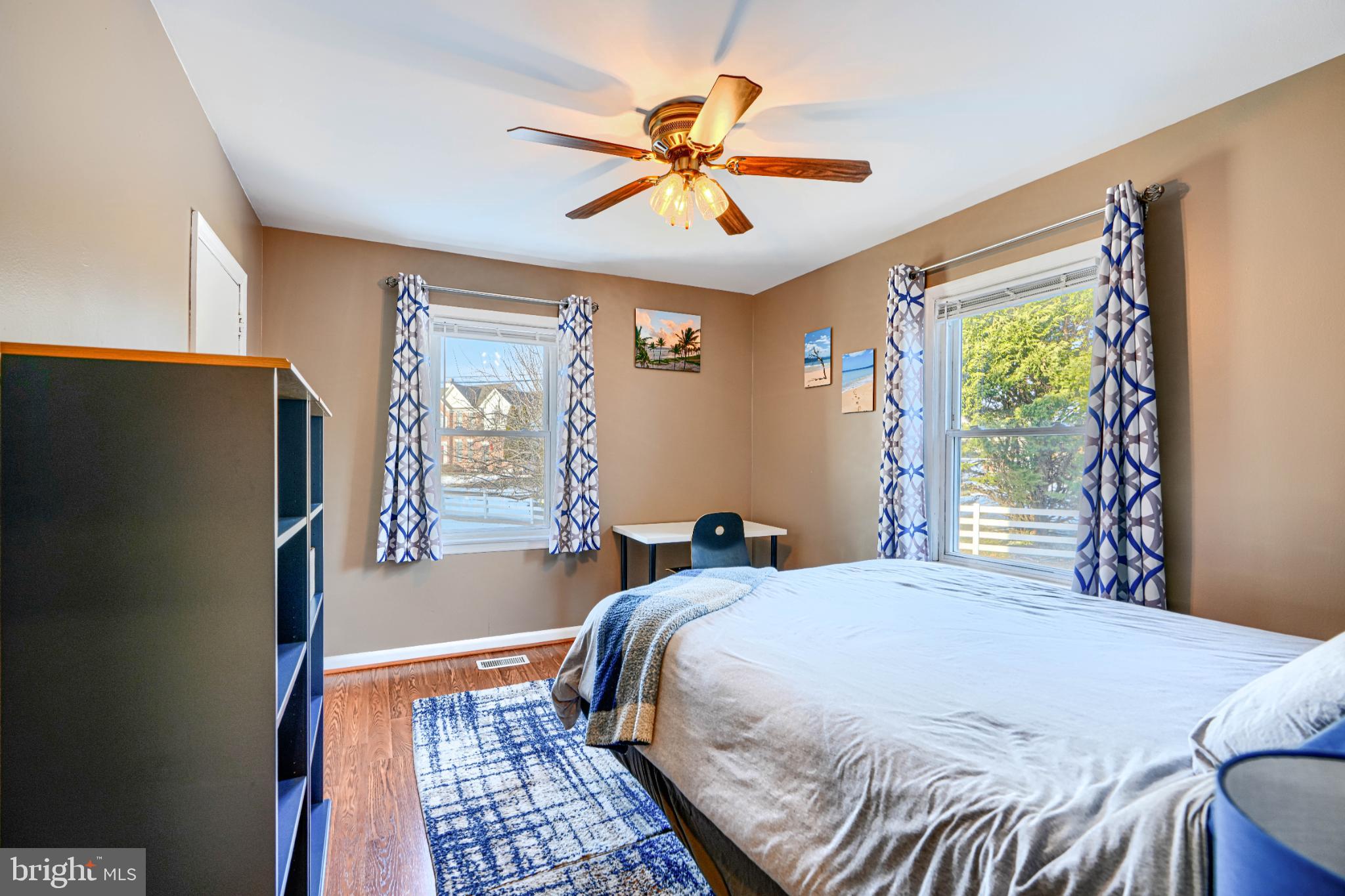 5706 Allender Road White Marsh, MD 21162 - Photo 24 of 61 a bedroom with a bed and a chandelier