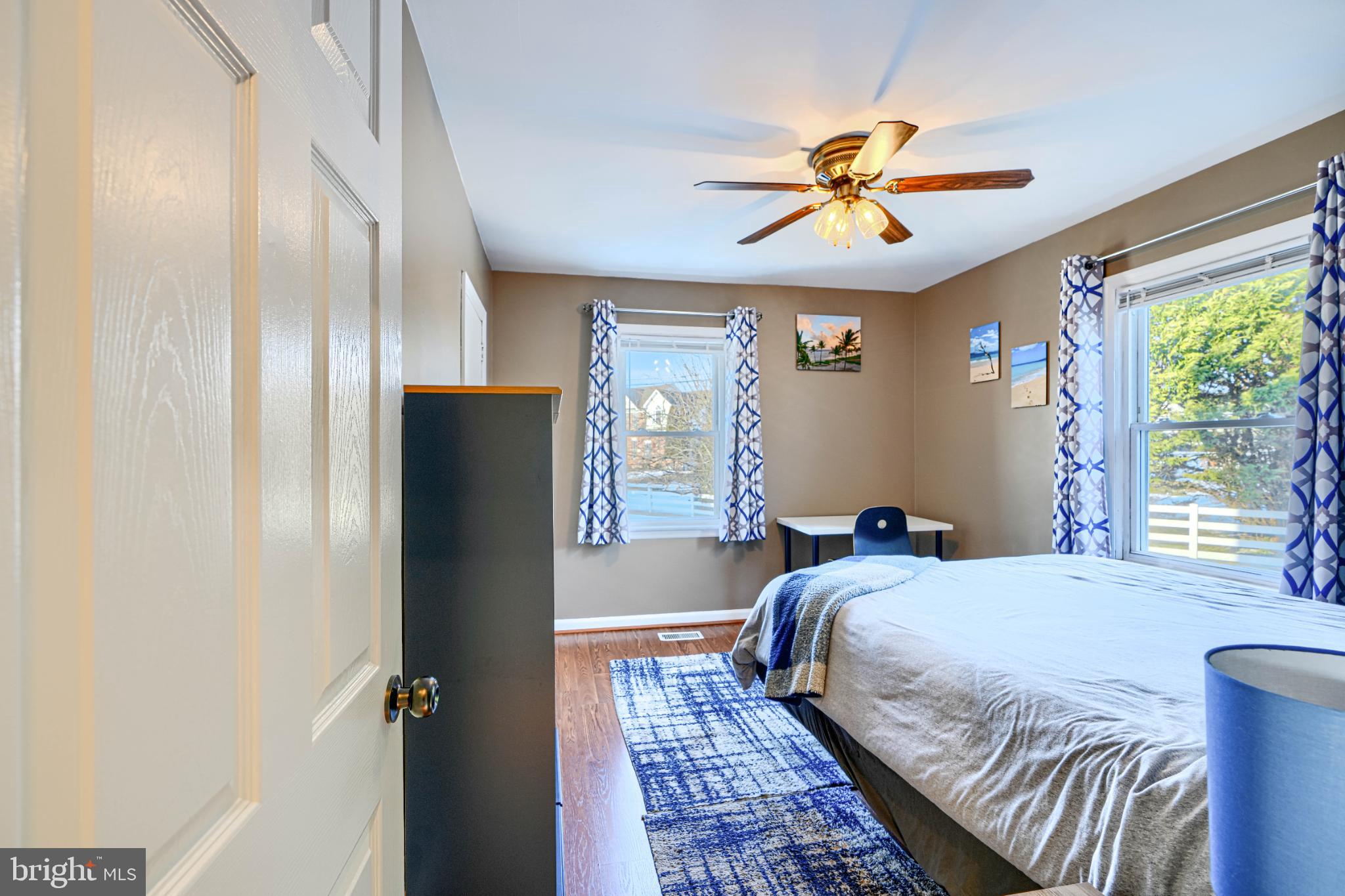 5706 Allender Road White Marsh, MD 21162 - Photo 25 of 61 a bedroom with a bed and a chandelier