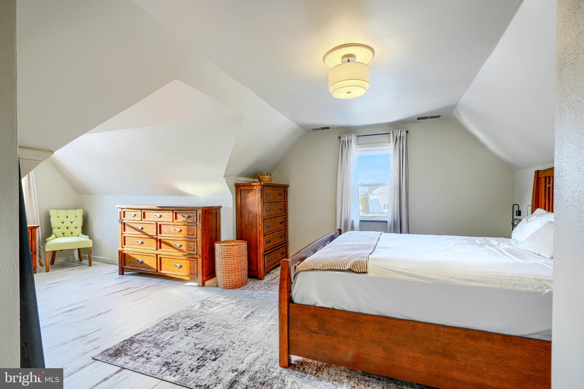 5706 Allender Road White Marsh, MD 21162 - Photo 27 of 61 a bedroom with a large bed and a chandelier