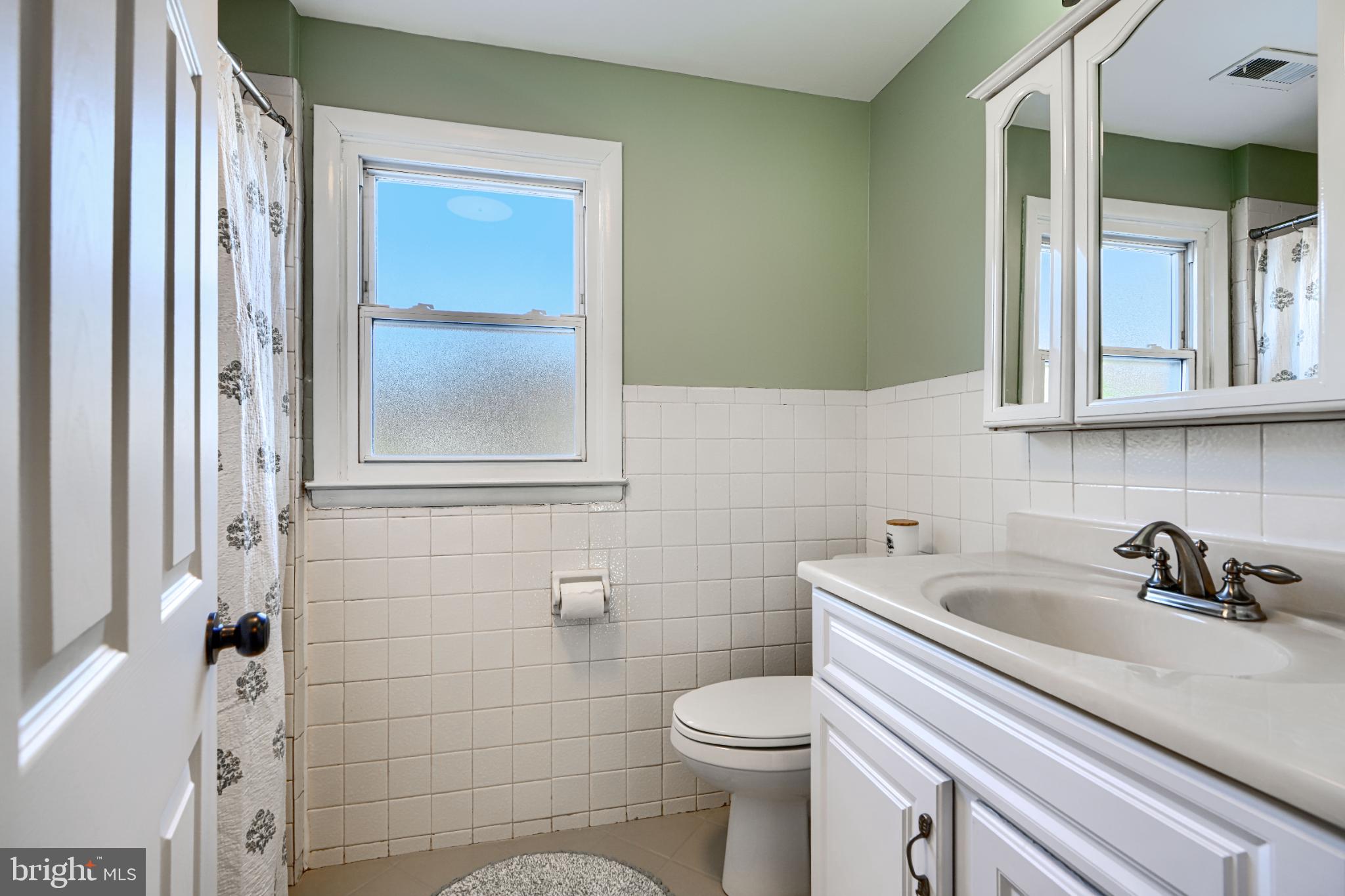 5706 Allender Road White Marsh, MD 21162 - Photo 40 of 61 a bathroom with a sink a toilet and shower