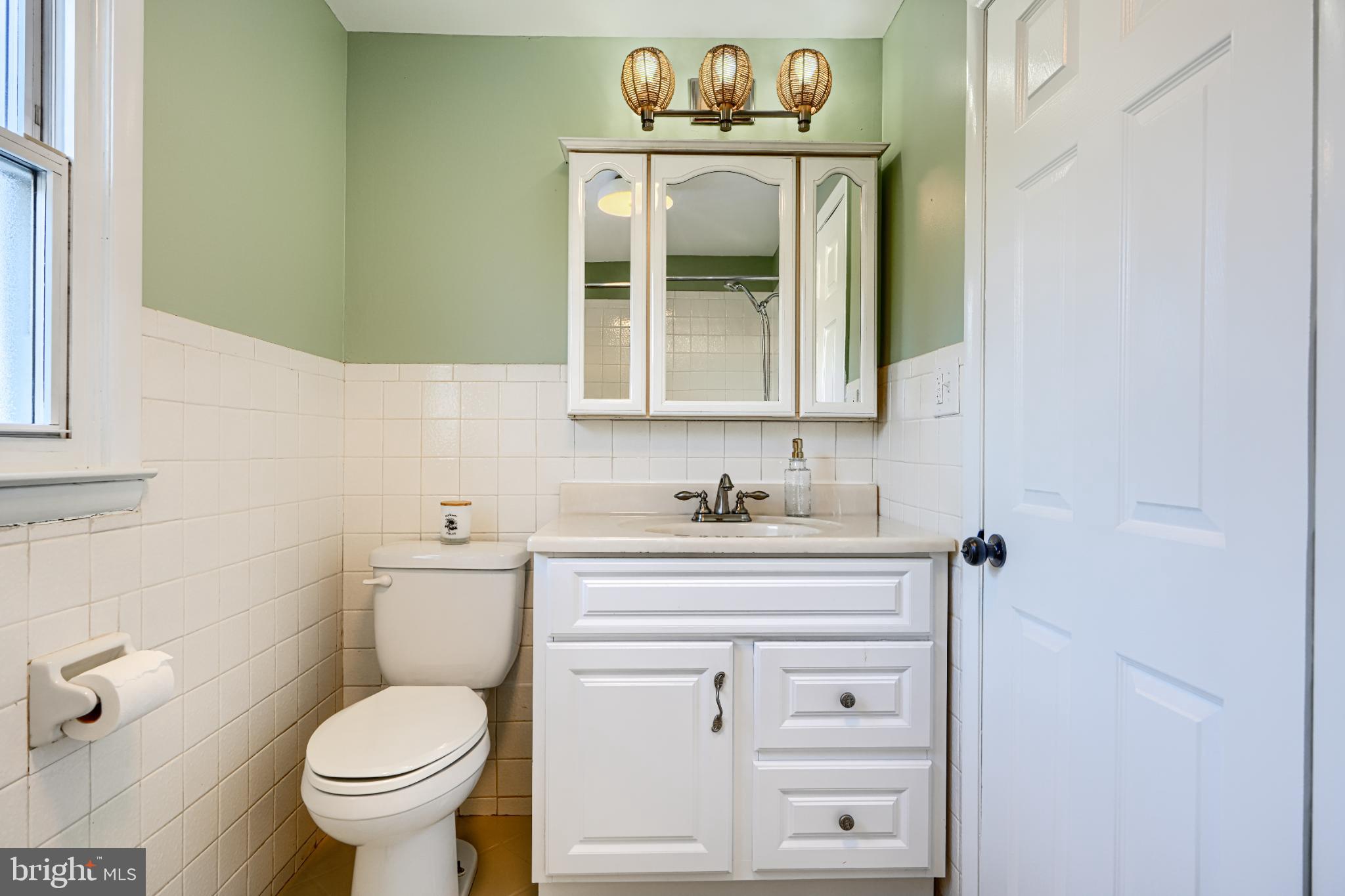 5706 Allender Road White Marsh, MD 21162 - Photo 41 of 61 a bathroom with a sink a toilet and mirror