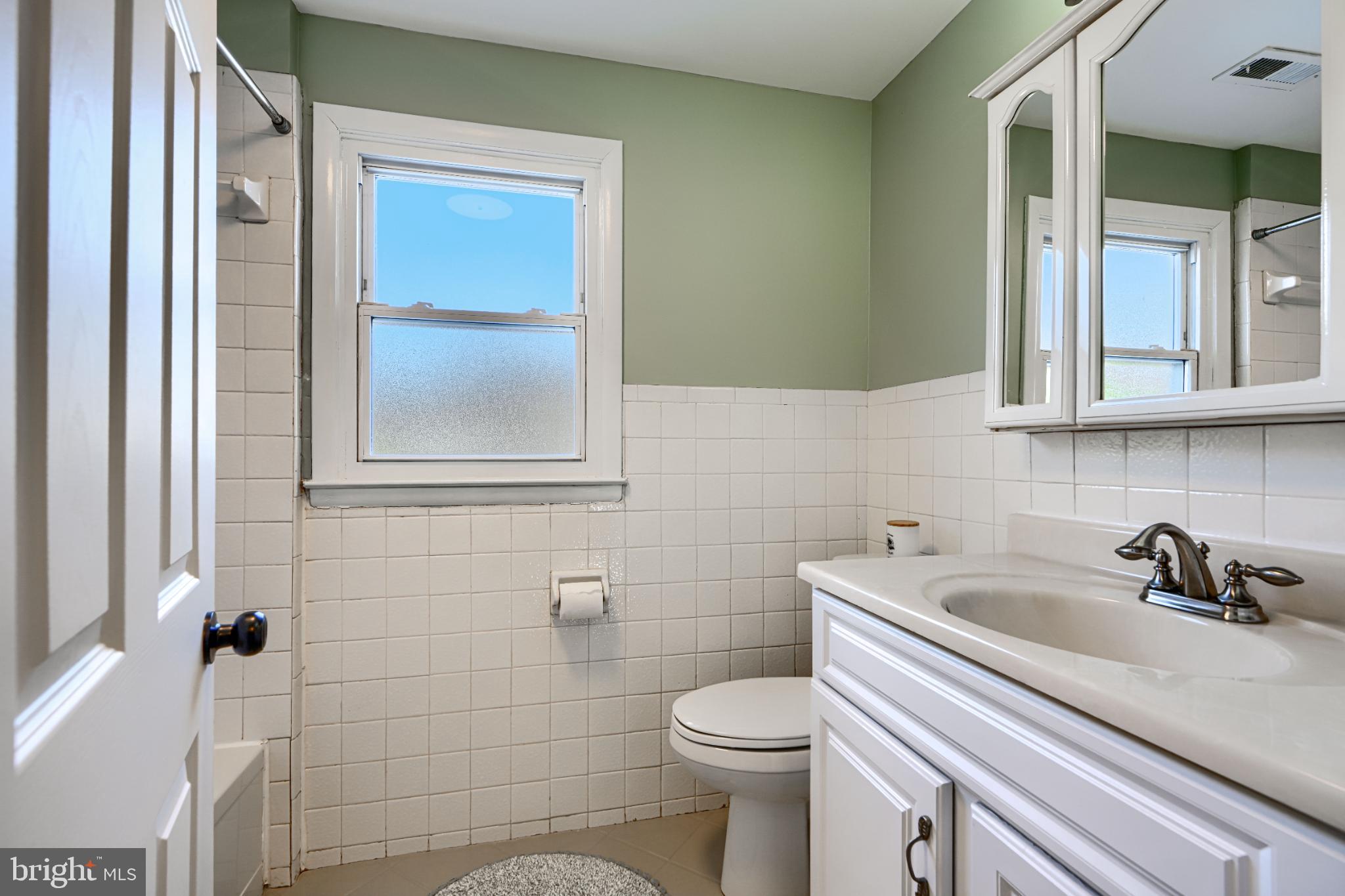 5706 Allender Road White Marsh, MD 21162 - Photo 42 of 61 a bathroom with a sink a toilet and shower