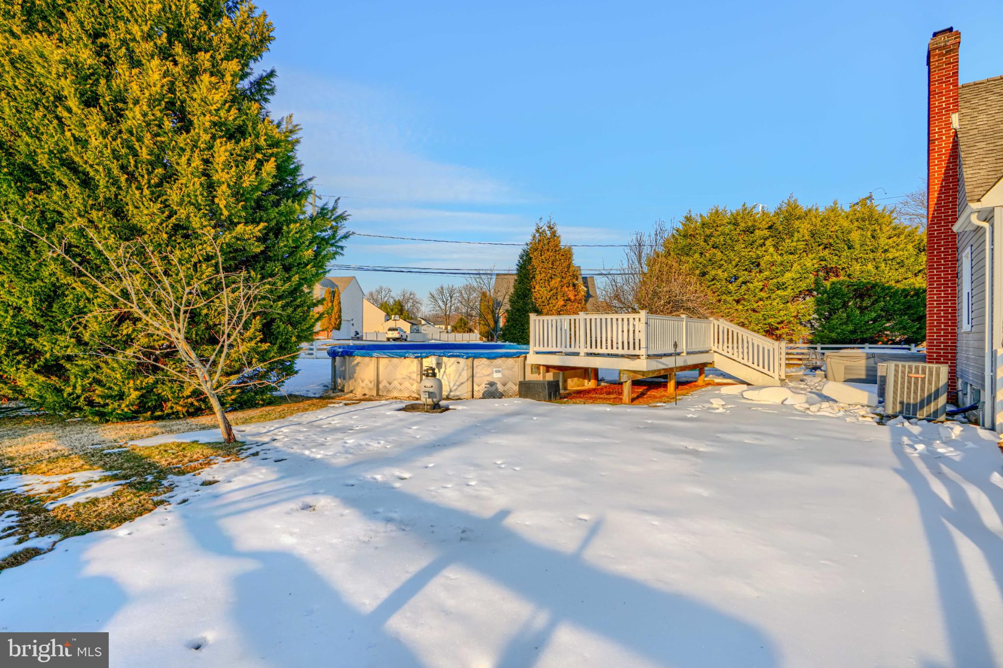 5706 Allender Road White Marsh, MD 21162 - Photo 47 of 61 Serene winter retreat with a poolside deck.