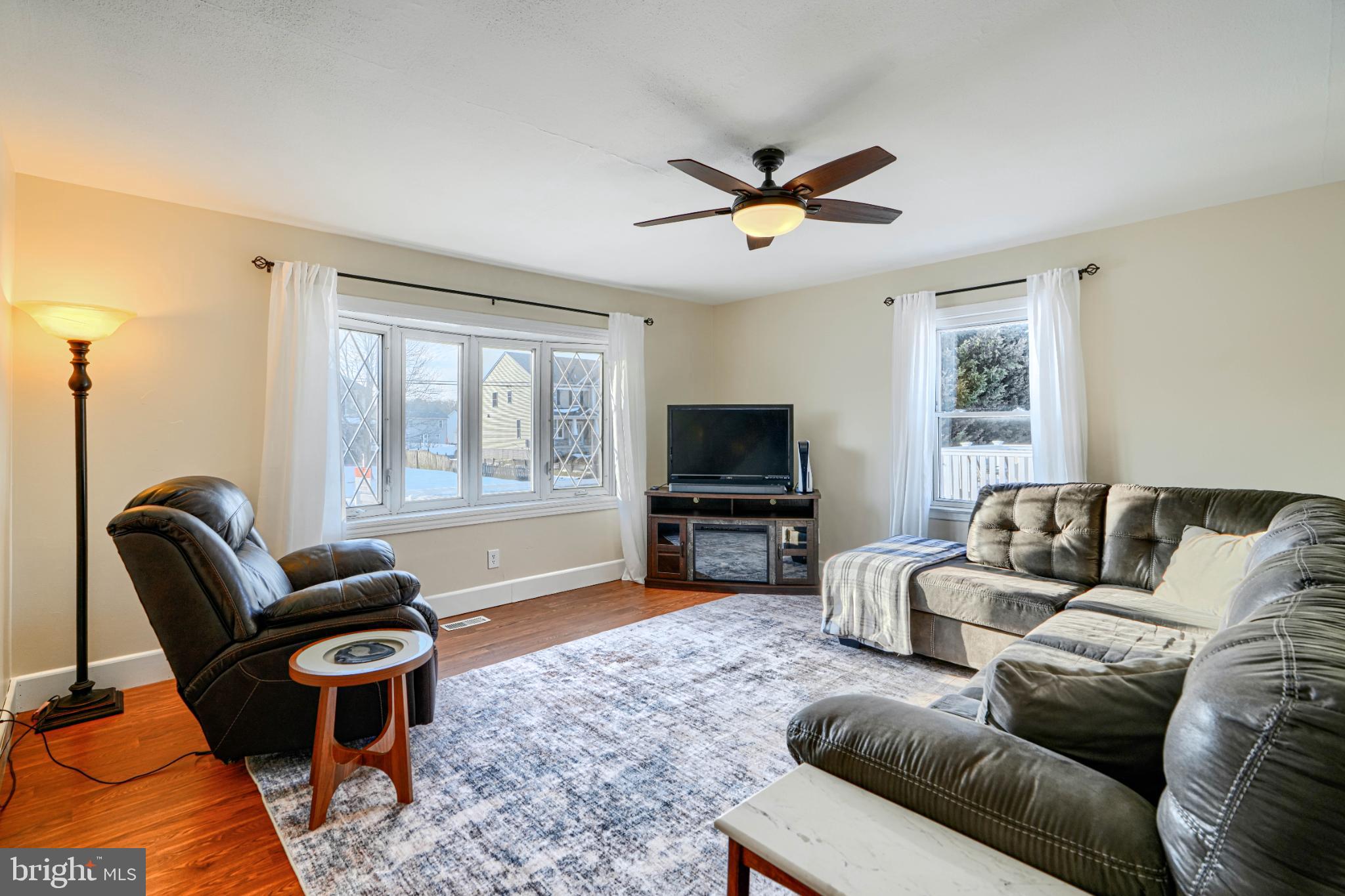 5706 Allender Road White Marsh, MD 21162 - Photo 5 of 61 a living room with furniture a window and a flat screen tv