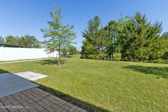 a view of a lake with a yard