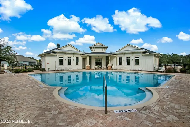 an aerial view of a house with outdoor space