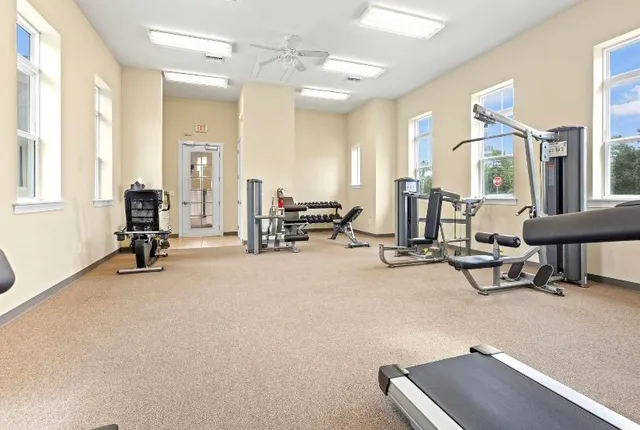 a view of a house with a backyard porch and sitting area