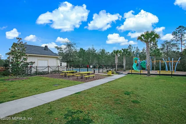 a view of a swimming pool with a yard