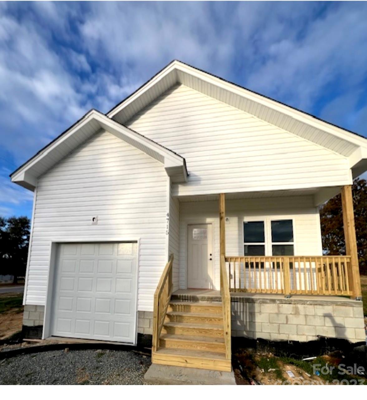 4715 State Line Road, Unit 7 Marshville, NC 28103 - Photo 1 of 1 a front view of a house with a yard