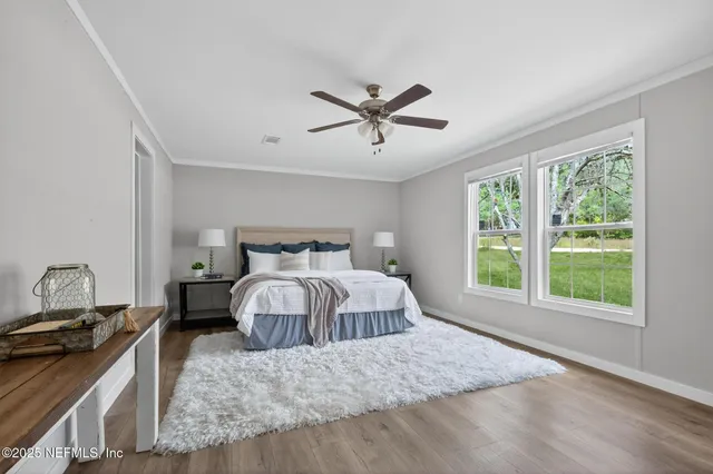 a bedroom with a large bed and a window