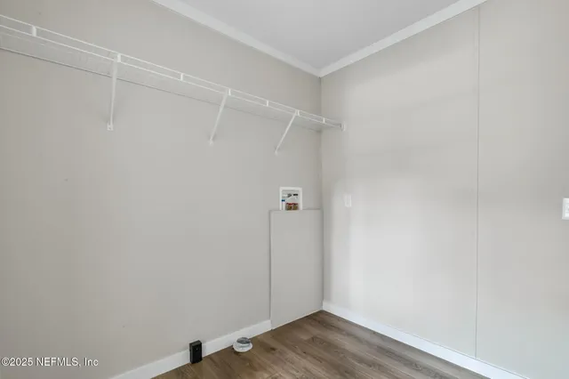 a bathroom with a sink toilet and a mirror