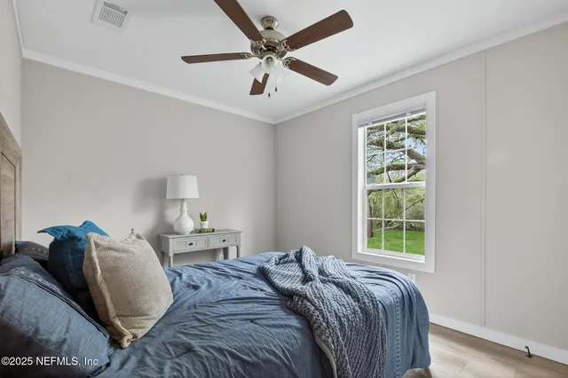a bathroom with a shower and a glass door