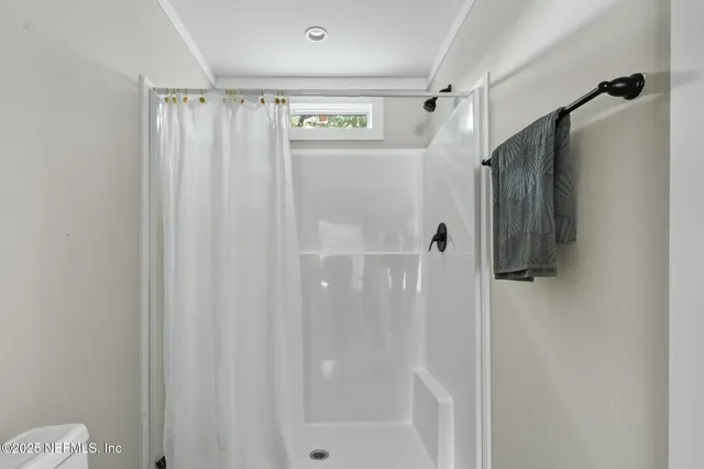 a view of a tree in the middle of a yard