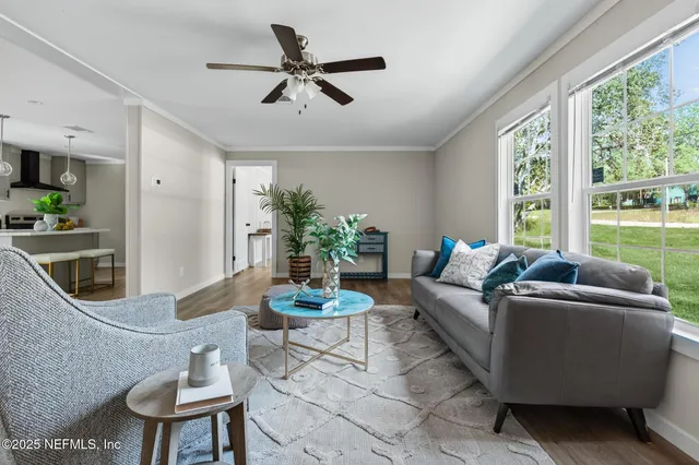 a living room with furniture and a window