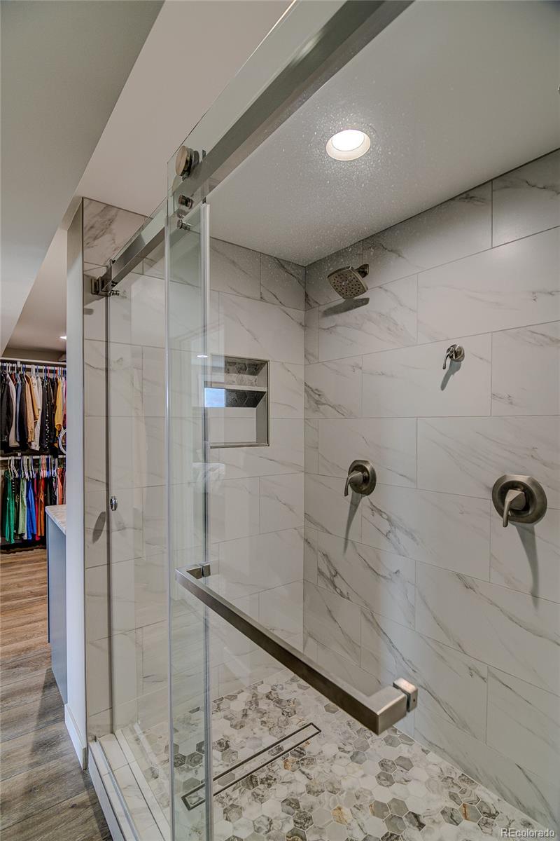 4531 East Best Road Larkspur, CO 80118 - Photo 17 of 49 a bathroom with a shower