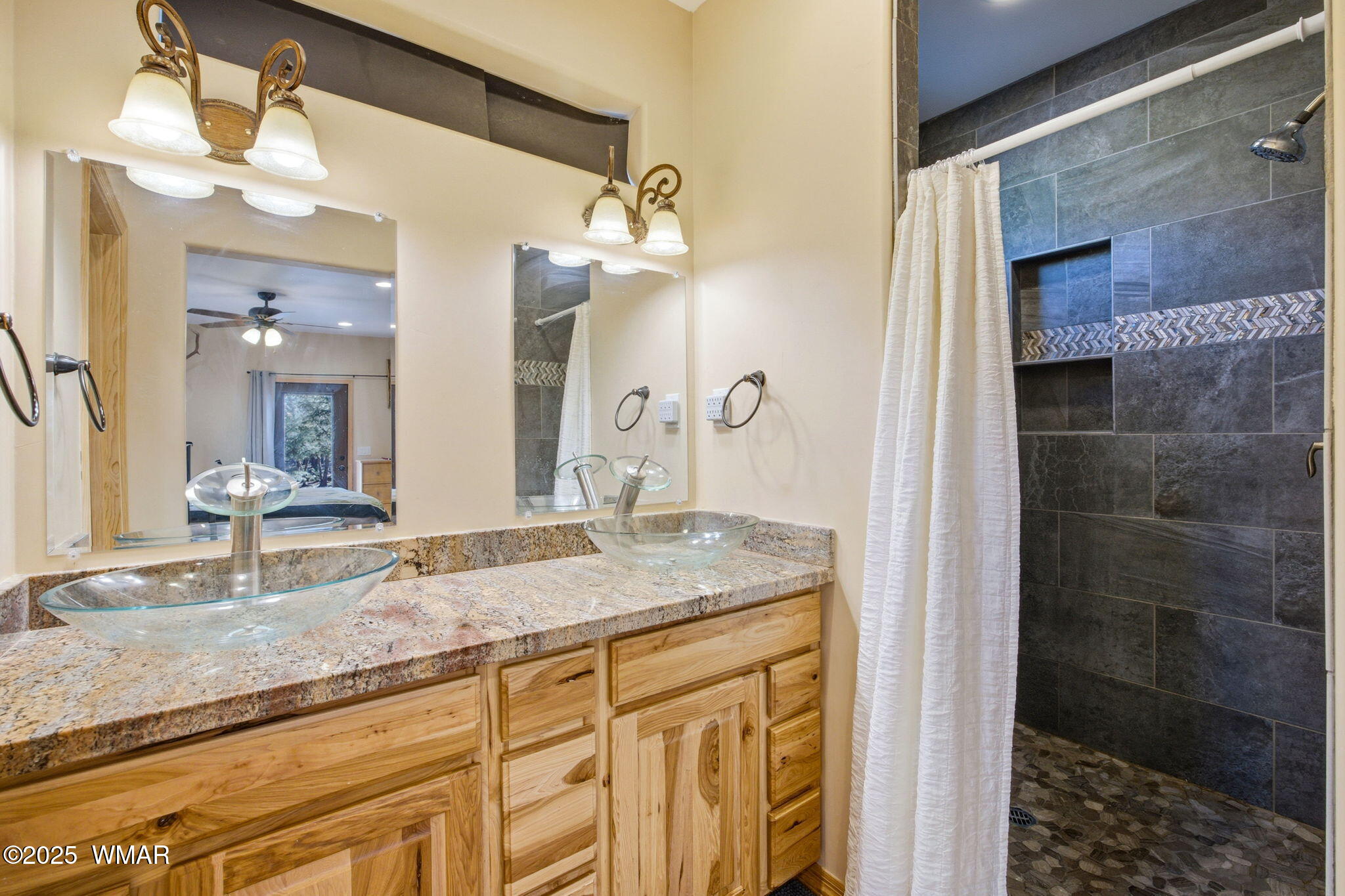 2009 Judy Ranch Road Overgaard, AZ 85933 - Photo 15 of 32 a bathroom with a granite countertop sink a mirror and shower