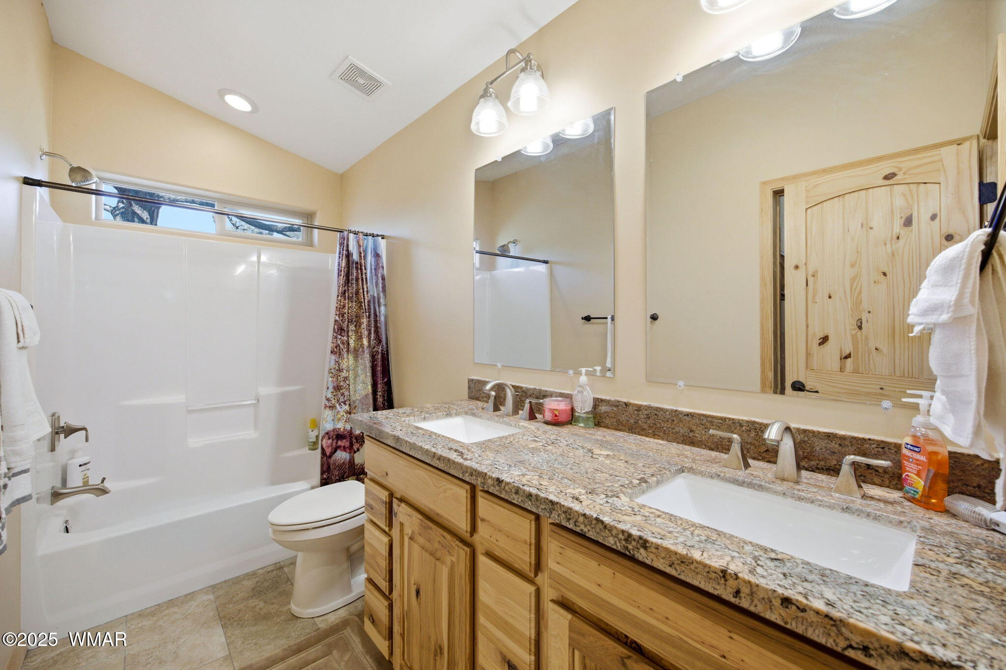 2009 Judy Ranch Road Overgaard, AZ 85933 - Photo 21 of 32 a bathroom with a granite countertop sink a mirror a toilet and shower