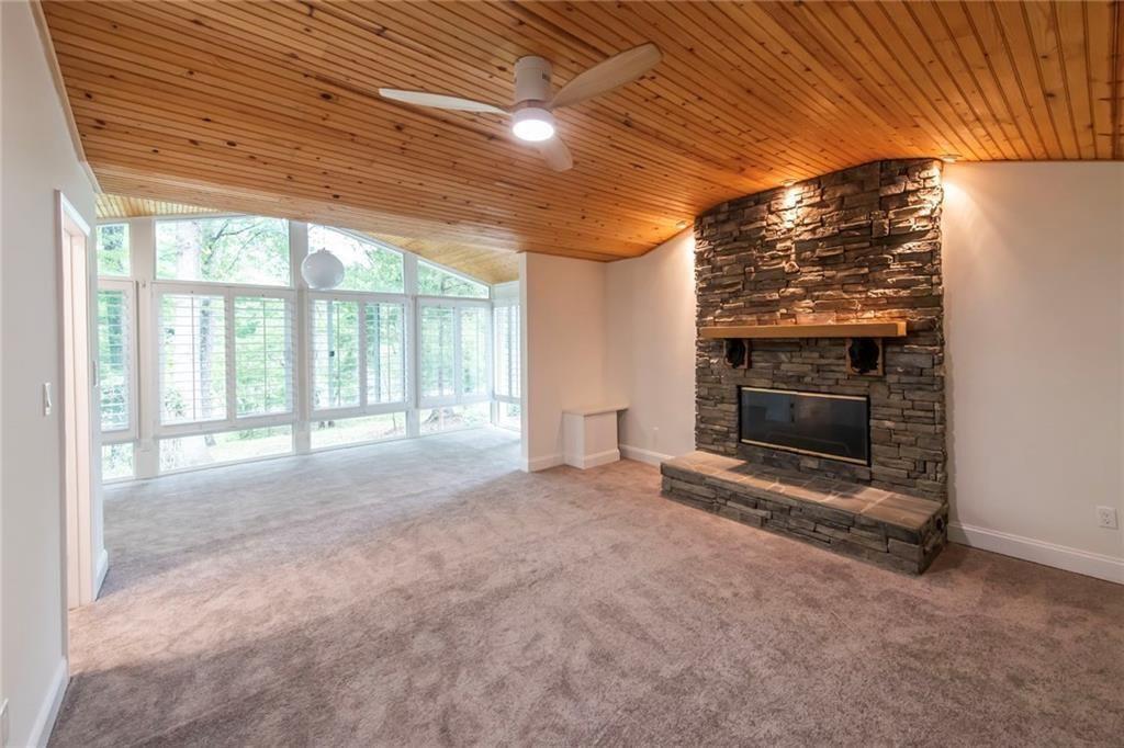 3819 Mason Creek Road Winston, GA 30187 - Photo 18 of 54 wooden floor in an empty room with a fireplace