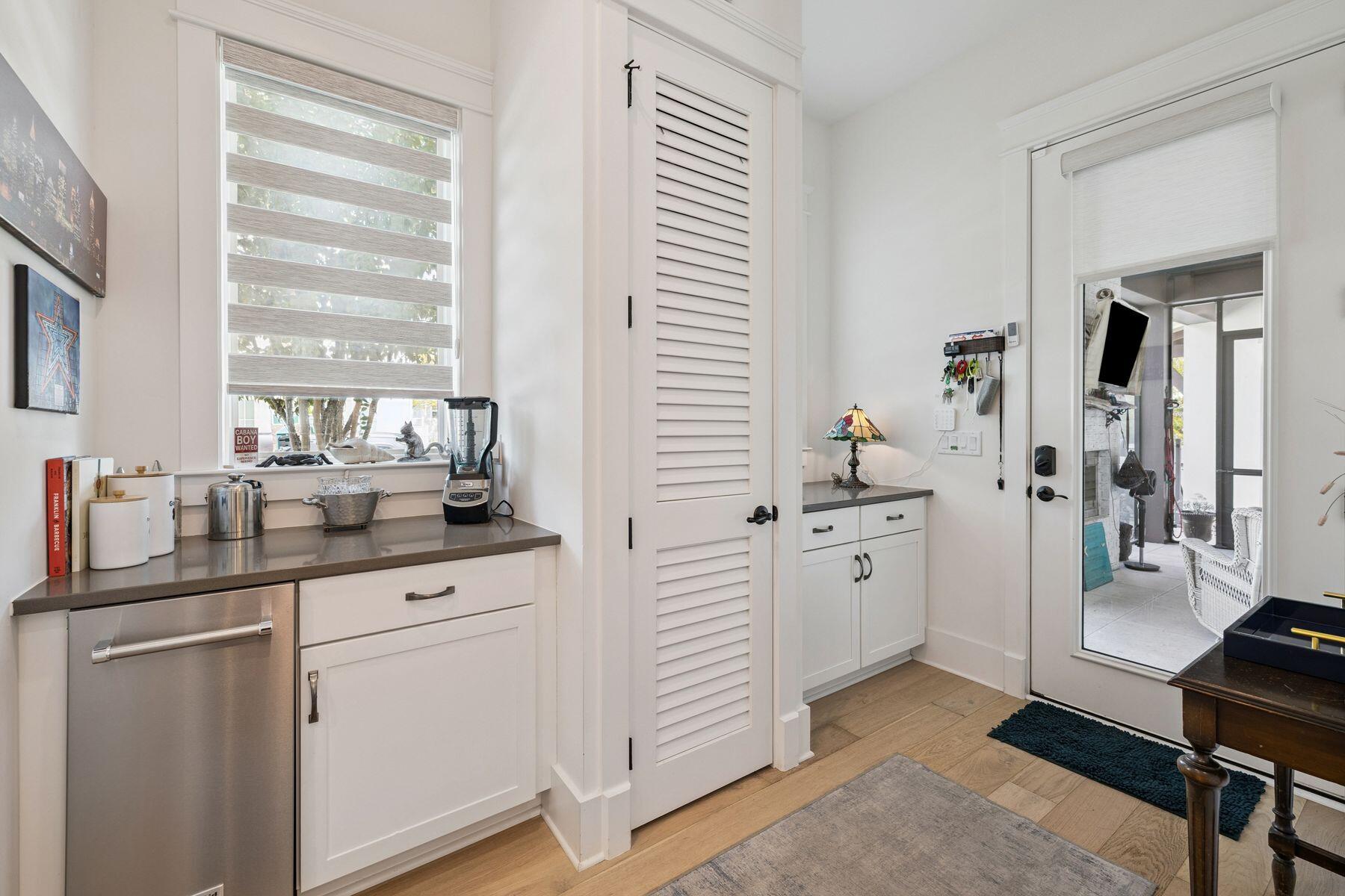 113 White Cliffs Drive Santa Rosa Beach, FL 32459 - Photo 12 of 38 a kitchen with white cabinets and sink