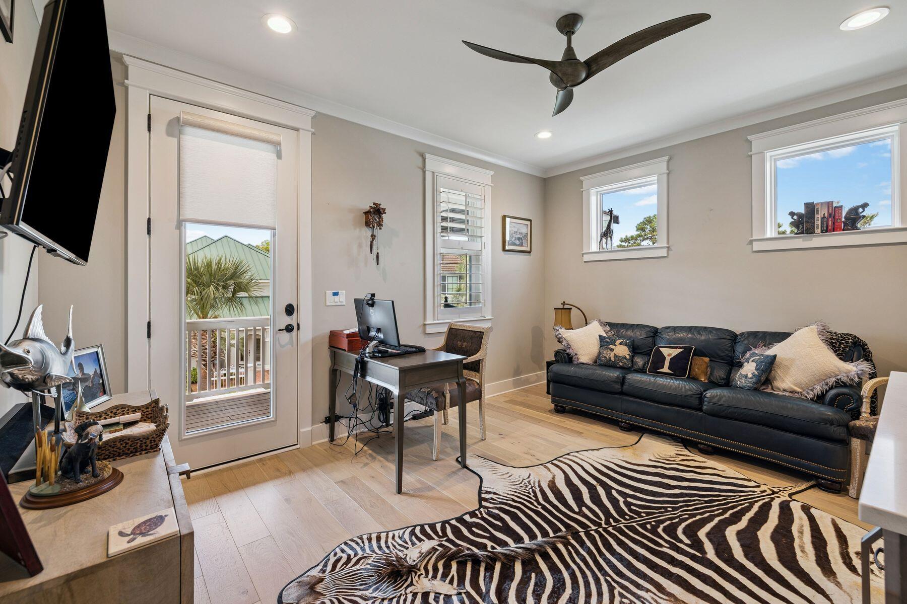 113 White Cliffs Drive Santa Rosa Beach, FL 32459 - Photo 23 of 38 a living room with furniture a flat screen tv and a window