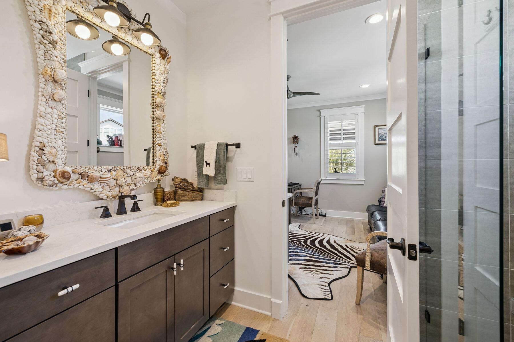 113 White Cliffs Drive Santa Rosa Beach, FL 32459 - Photo 25 of 38 a en suite bathroom with a double vanity sink a mirror and shower