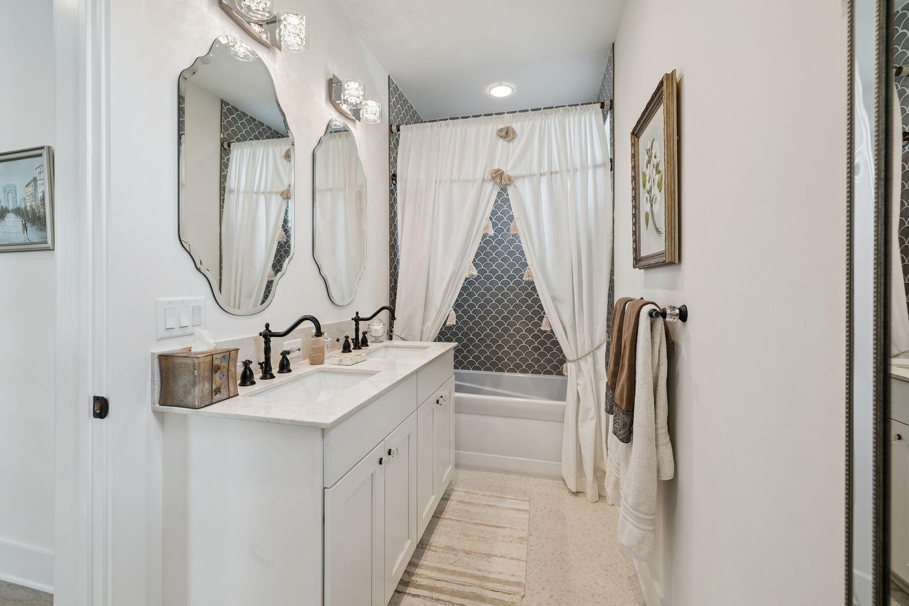 113 White Cliffs Drive Santa Rosa Beach, FL 32459 - Photo 31 of 38 a bathroom with a double vanity sink and a mirror