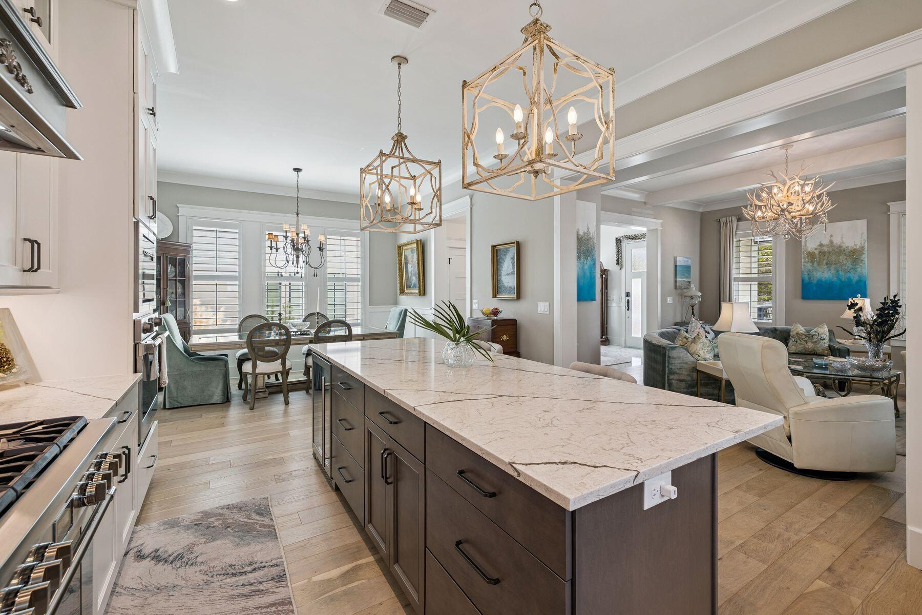 113 White Cliffs Drive Santa Rosa Beach, FL 32459 - Photo 6 of 38 a large kitchen with kitchen island a large counter space a sink appliances and living room view