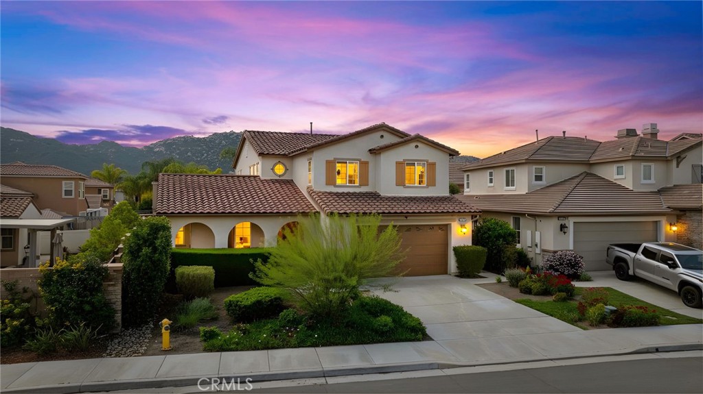 45971 Hunter Lodge Lane Temecula, CA 92592 - Photo 1 of 1 a front view of a house with a garden
