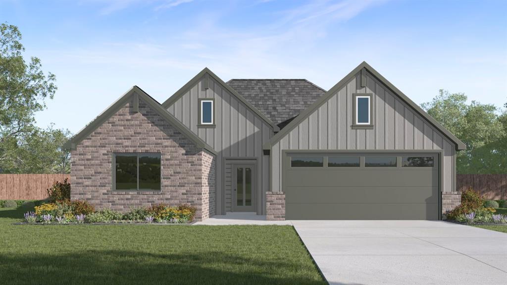 Contemporary exterior featuring a stone and vertical siding facade, an attached garage with an overhead door, a paved driveway, a shingled roof, and landscaped garden beds