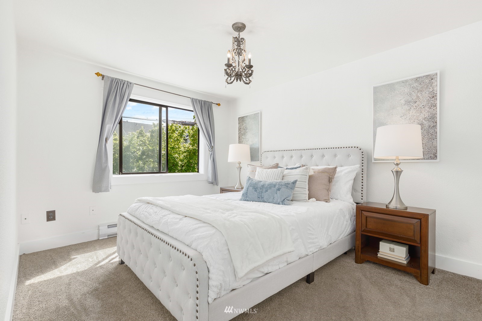 1400 Northwest 60th Street, Unit 202 Seattle, WA 98107 - Photo 12 of 23 a bedroom with a bed and a window