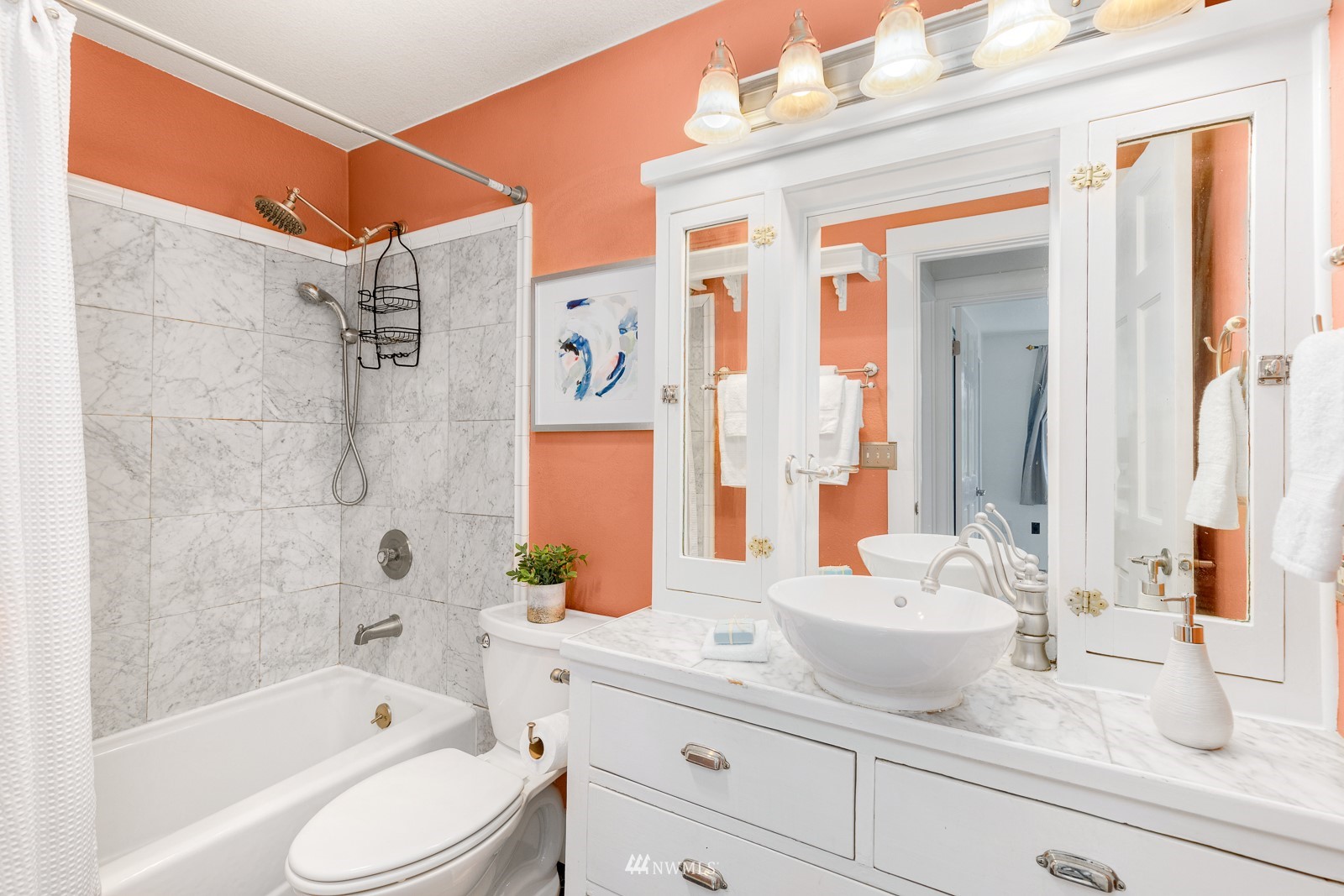 1400 Northwest 60th Street, Unit 202 Seattle, WA 98107 - Photo 17 of 23 a bathroom with a sink a toilet and shower