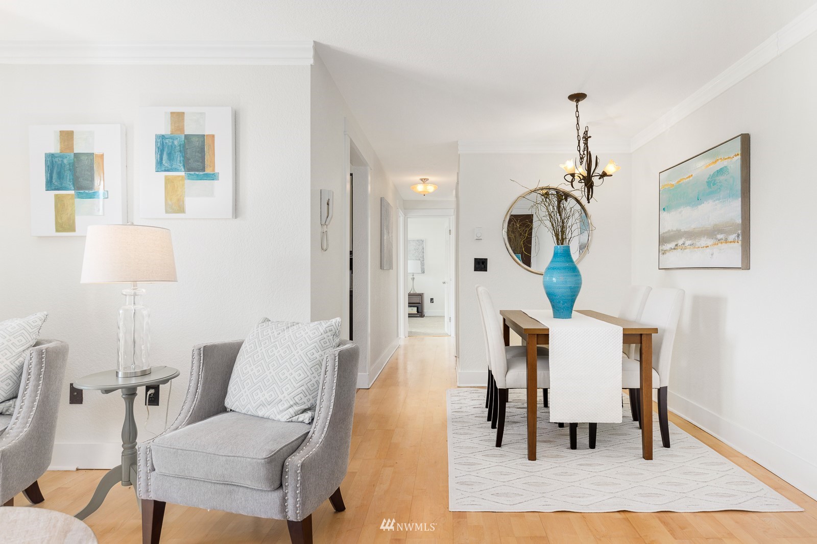 1400 Northwest 60th Street, Unit 202 Seattle, WA 98107 - Photo 7 of 23 a living room with furniture and a table
