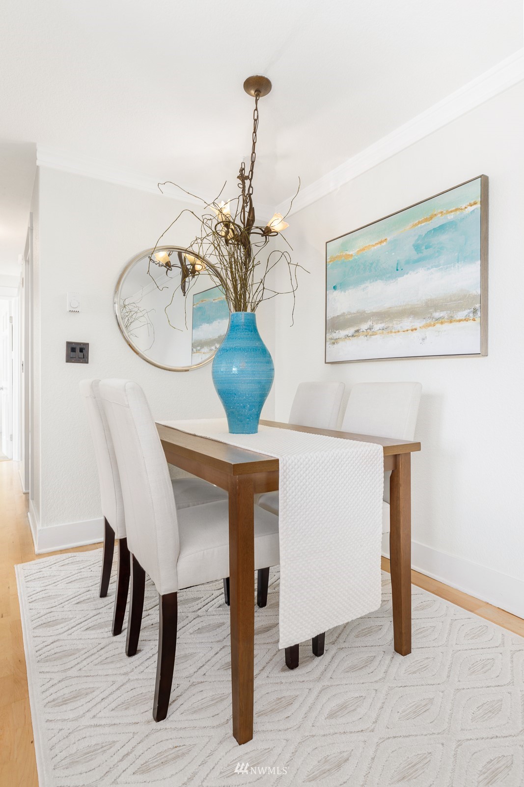 1400 Northwest 60th Street, Unit 202 Seattle, WA 98107 - Photo 8 of 23 a dining room with furniture and wooden floor