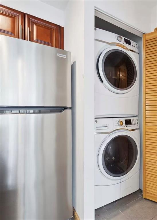 229 55th Street, Unit 2A Brooklyn, NY 11220 - Photo 11 of 12 a utility room with dryer and washer