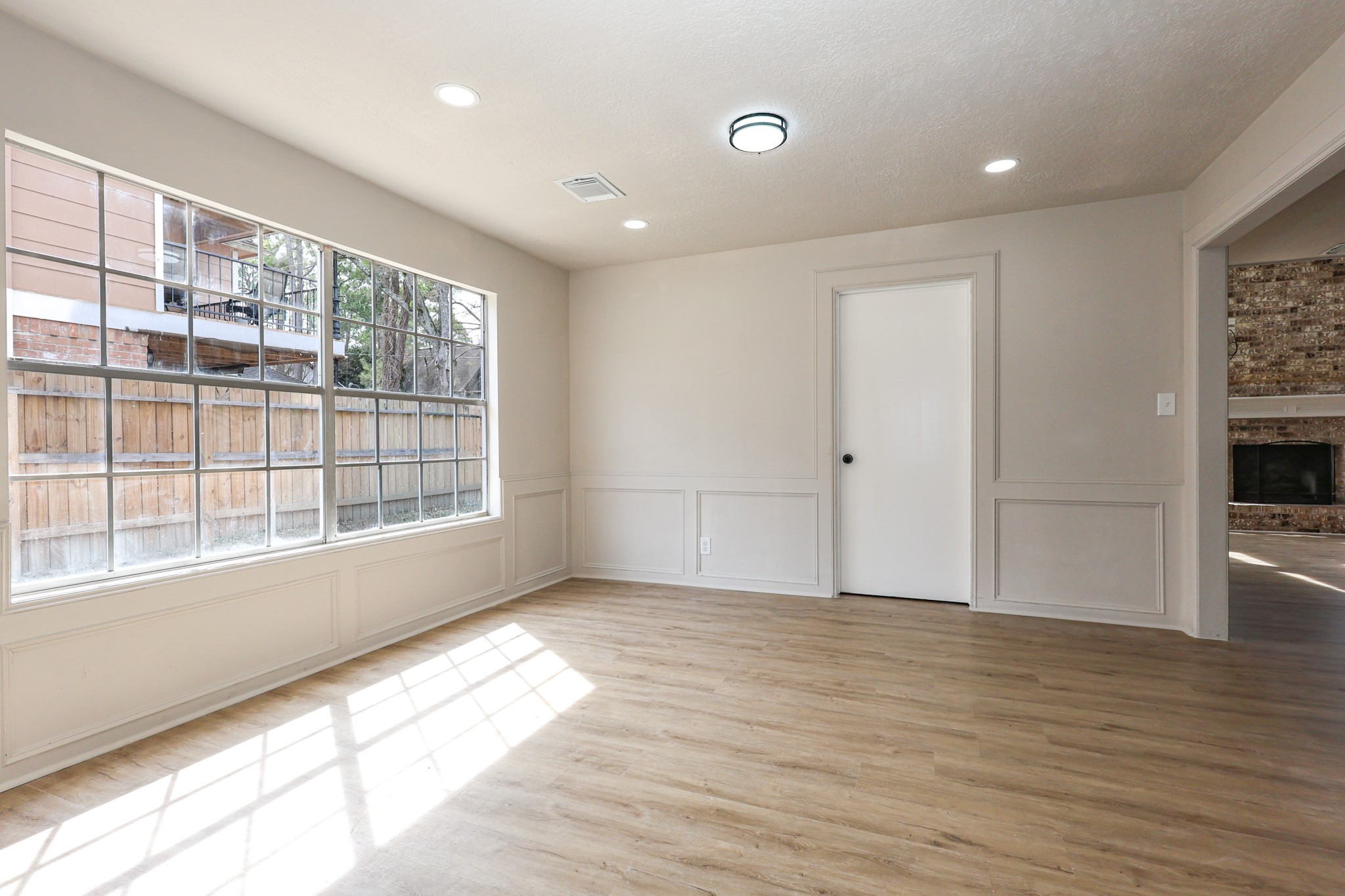 20719 Burnt Amber Lane Houston, TX 77073 - Photo 13 of 32 a view of empty room with wooden floor and fan