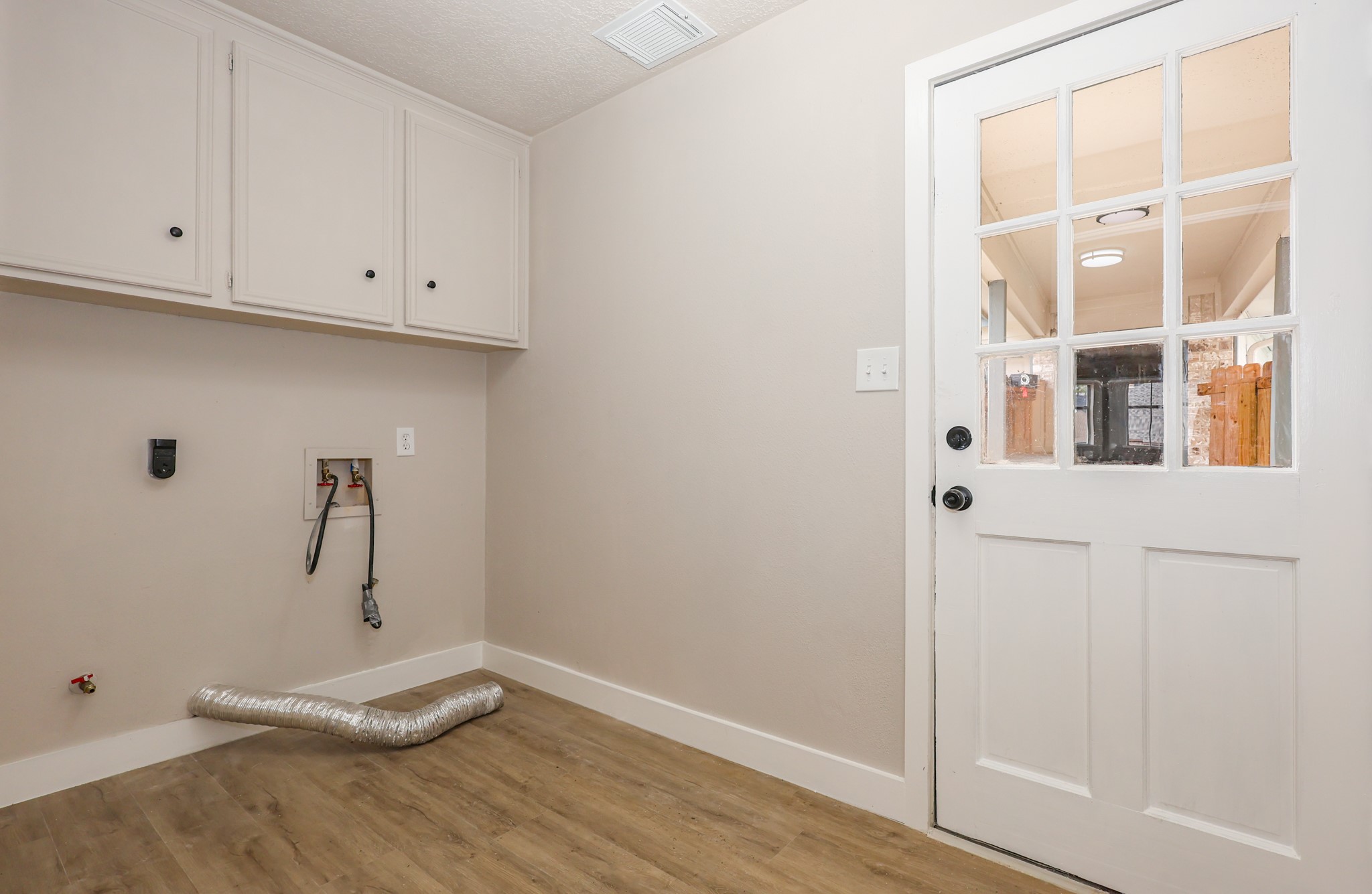 20719 Burnt Amber Lane Houston, TX 77073 - Photo 14 of 32 a view of a room with rack on the wall