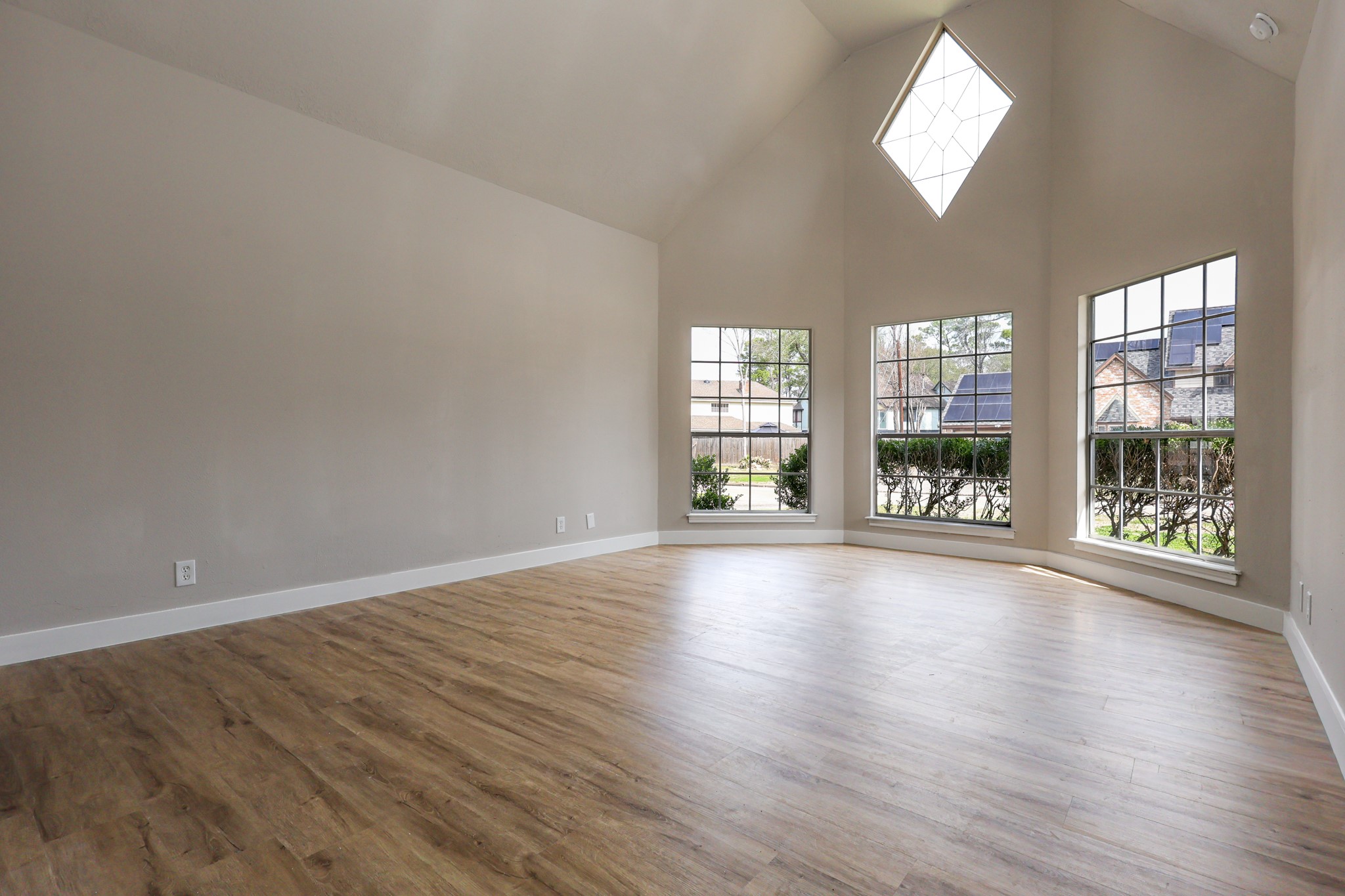 20719 Burnt Amber Lane Houston, TX 77073 - Photo 15 of 32 an empty room with wooden floor and windows