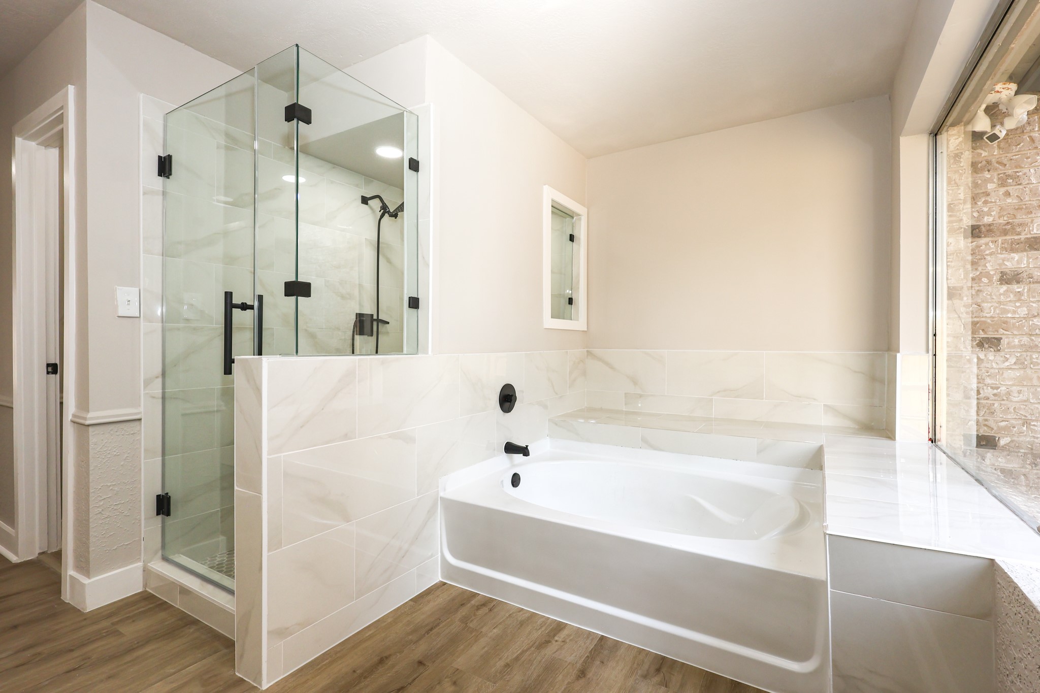 20719 Burnt Amber Lane Houston, TX 77073 - Photo 18 of 32 a bathroom with a tub shower and sink