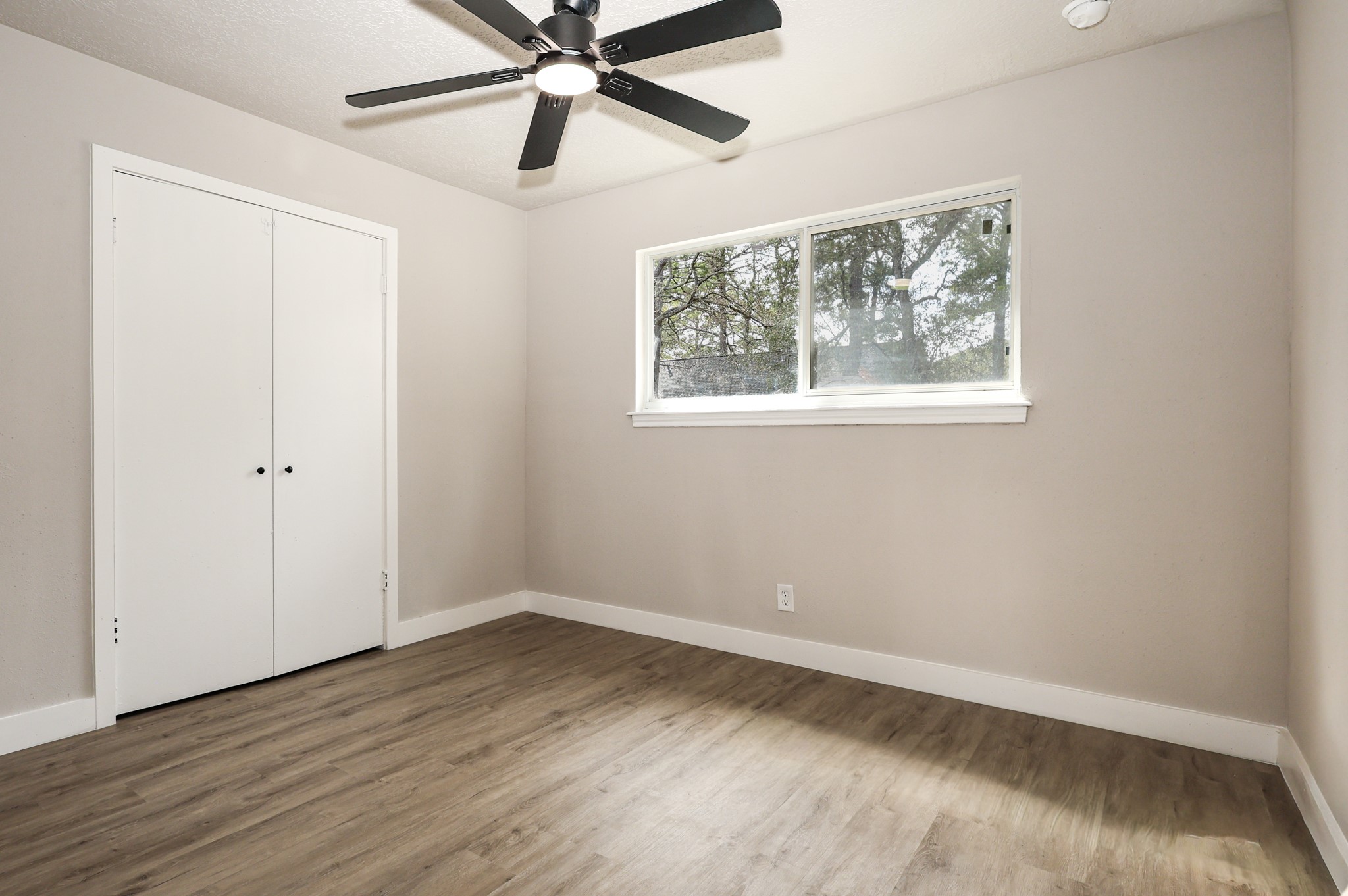20719 Burnt Amber Lane Houston, TX 77073 - Photo 21 of 32 wooden floor in an empty room with a window