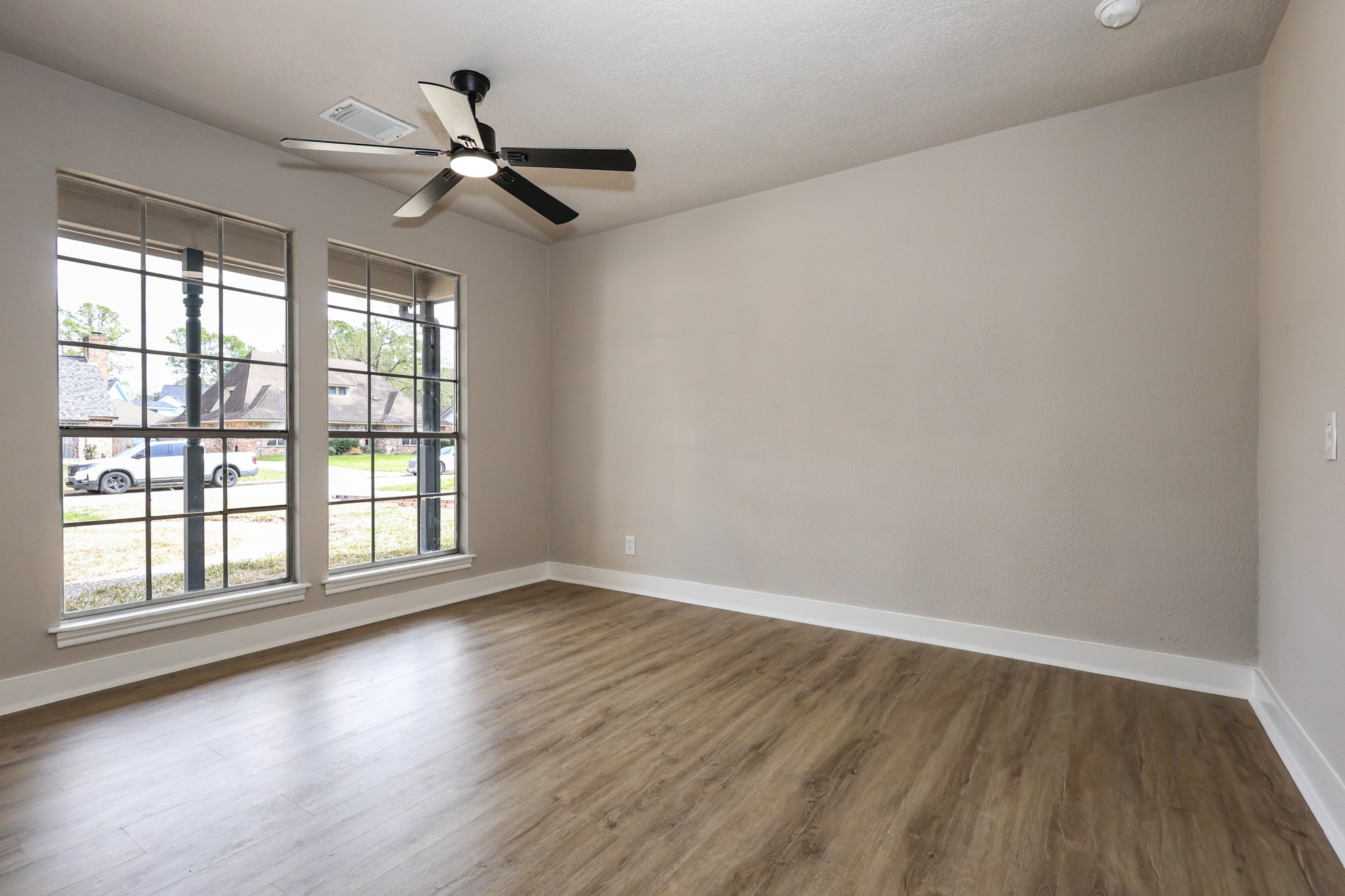 20719 Burnt Amber Lane Houston, TX 77073 - Photo 22 of 32 wooden floor in an empty room with a window