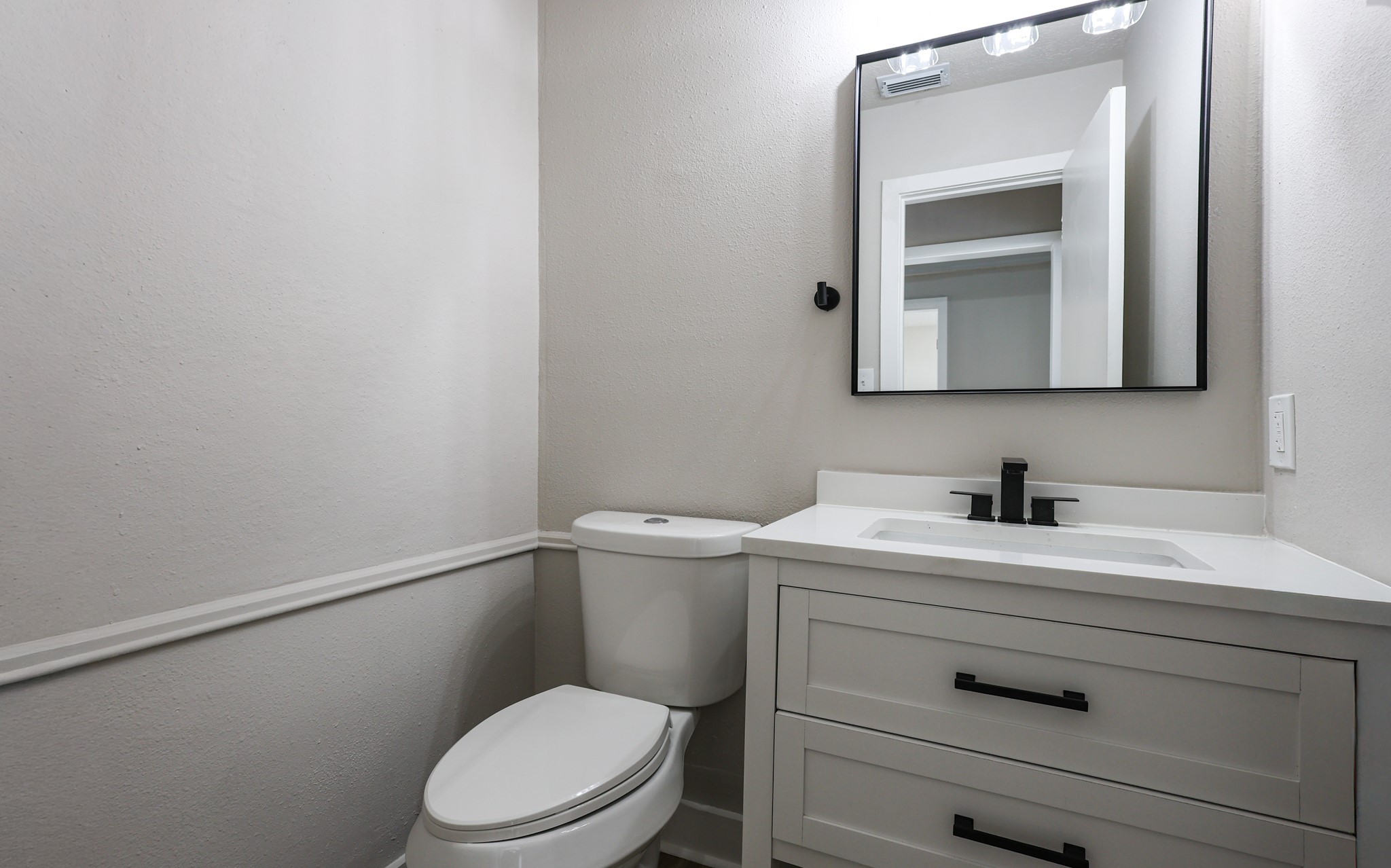 20719 Burnt Amber Lane Houston, TX 77073 - Photo 27 of 32 a bathroom with a toilet sink vanity and mirror