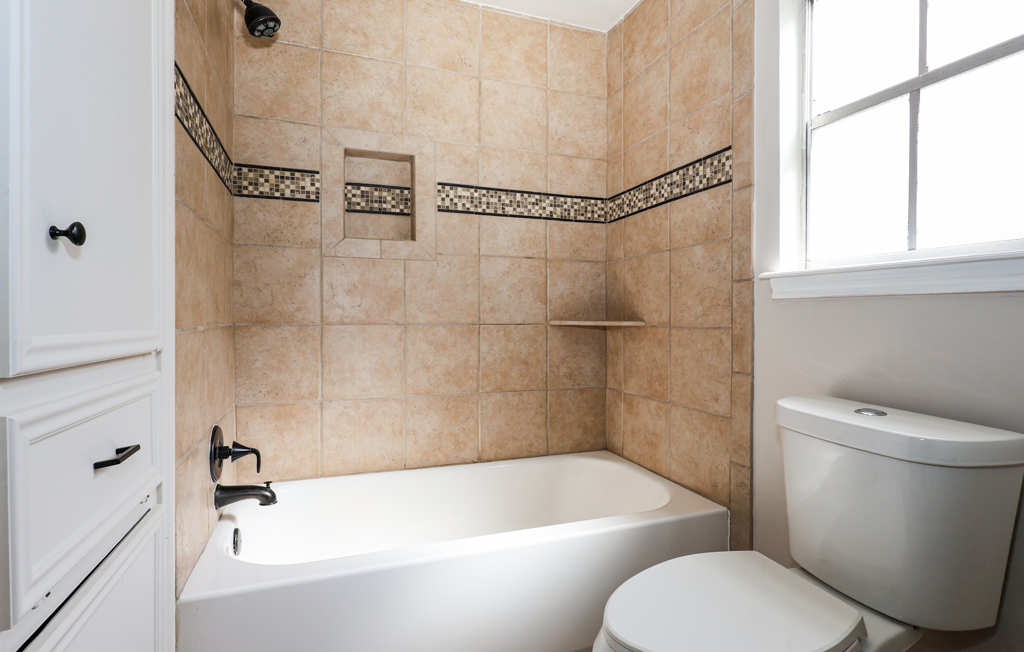 20719 Burnt Amber Lane Houston, TX 77073 - Photo 29 of 32 a bathroom with a toilet and a bathtub