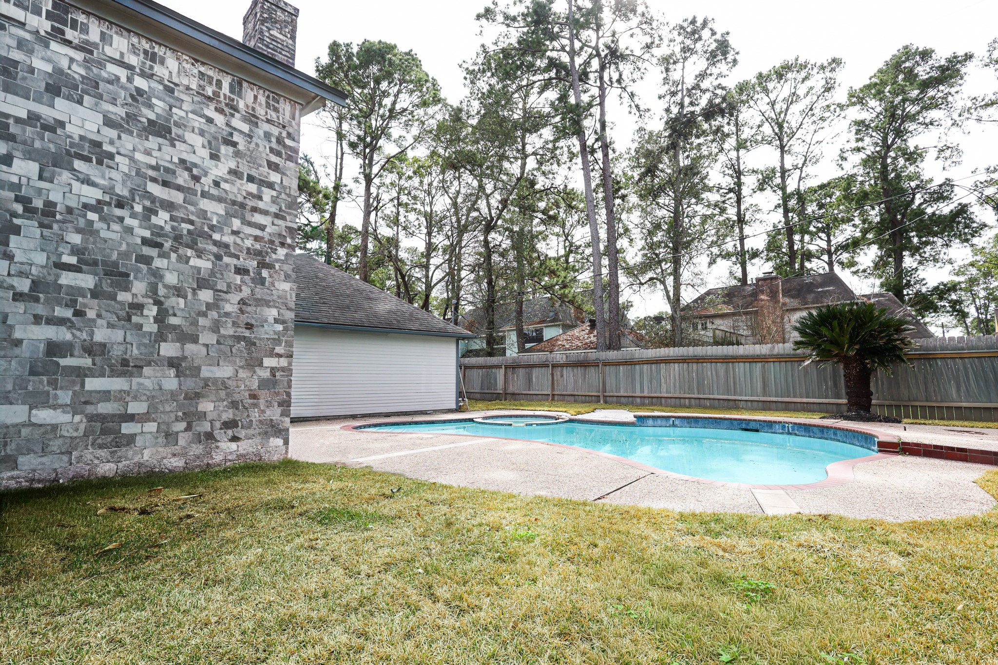 20719 Burnt Amber Lane Houston, TX 77073 - Photo 30 of 32 a swimming pool with some trees in the background